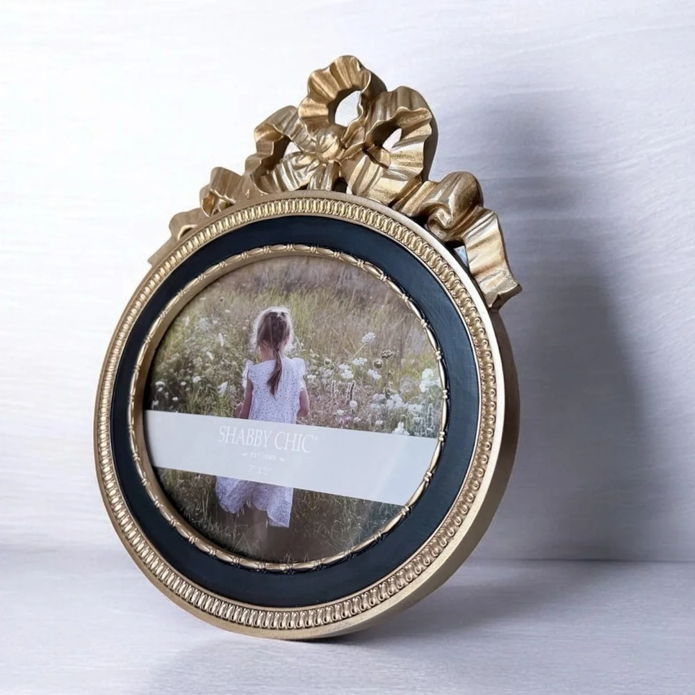 Ornate Oval Gold Photo Frame with Black Trim bow on top 7”x5”